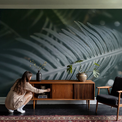 Large wall mural wallpaper with a green leaf design