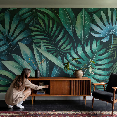 Premium photo wallpaper with a tropical leaves motif