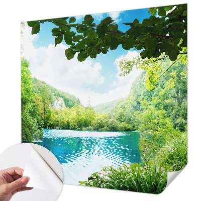 Baby room wall mural with a natural oasis motif