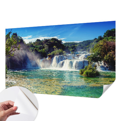 Nursery wall mural with a waterfall landscape design