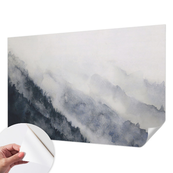 Removable wall mural with a misty mountain design