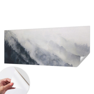 Removable wall mural with a misty mountain design