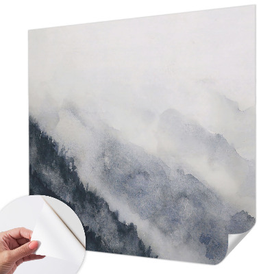 Removable wall mural with a misty mountain design