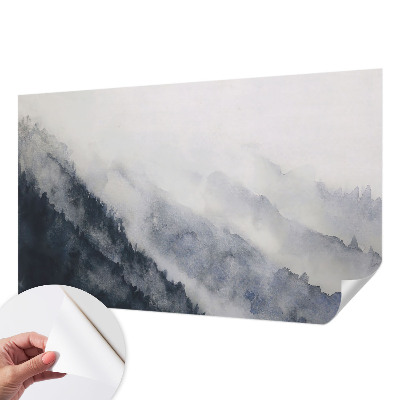 Removable wall mural with a misty mountain design