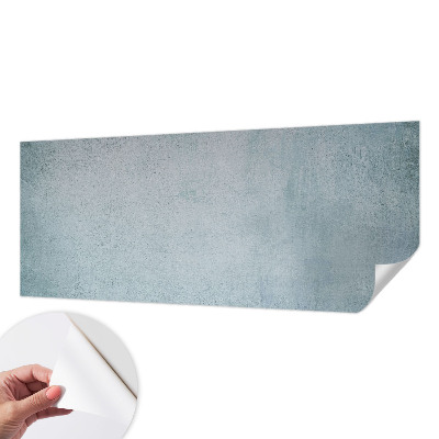 Peel and stick wall mural with a gray concrete finish for bedroom walls