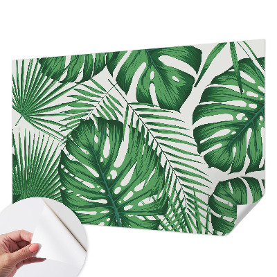Removable wall mural with a tropical leaves design
