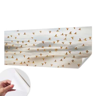 Baby room wall mural with birds in flight motif