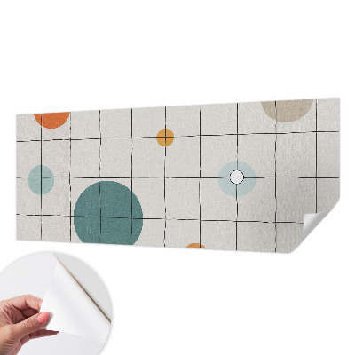 Self-adhesive wall mural with a colored circles design