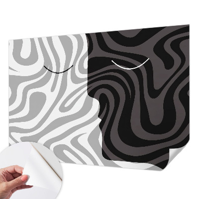Stick-on wall mural with an abstract faces design