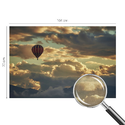 Nursery wall mural with a balloon floating among the clouds