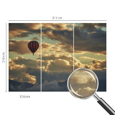 Nursery wall mural with a balloon floating among the clouds