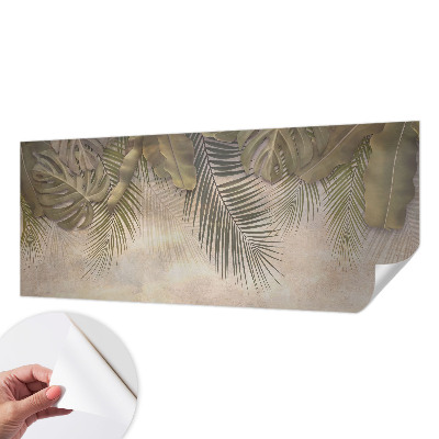 Baby room wall mural with a tropical leaves pattern