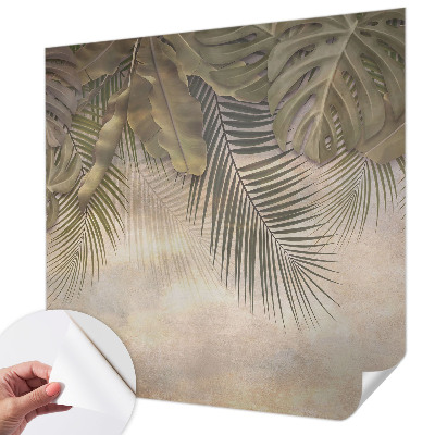 Baby room wall mural with a tropical leaves pattern