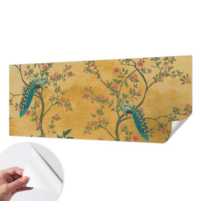 Peel and stick wall mural with a peacock tree design