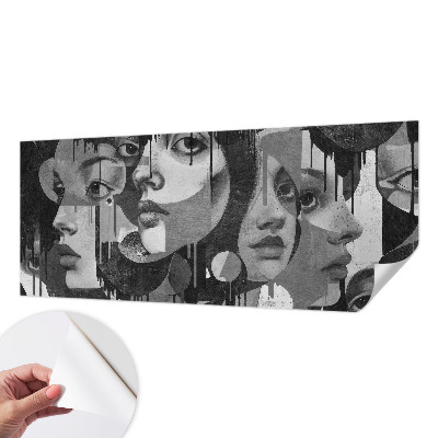 Baby room wall mural with a design of women's faces