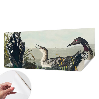 Children's wall mural with a design of birds flying over water