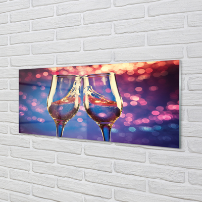 Acrylic print Glasses of champagne colored background