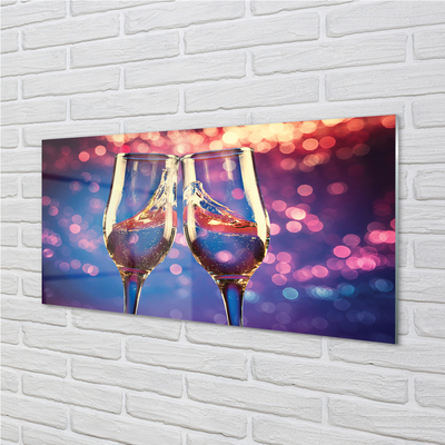 Acrylic print Glasses of champagne colored background