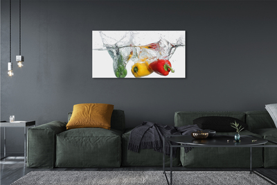 Canvas print Colored peppers in water