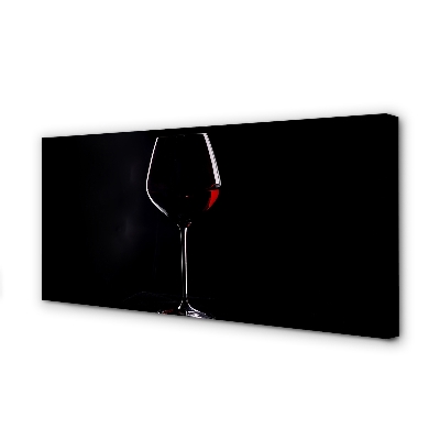 Canvas print Black background with a glass of wine