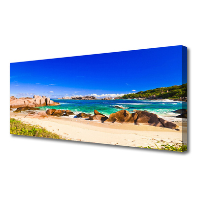 Canvas print Rocky beach sea landscape blue yellow green