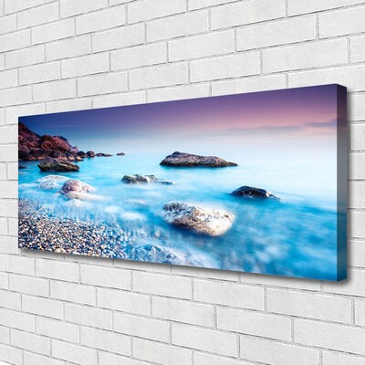 Canvas print Sea stones beach landscape blue grey pink