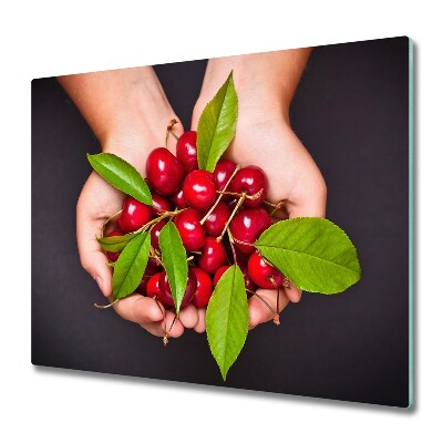 Chopping board Cherries in hands