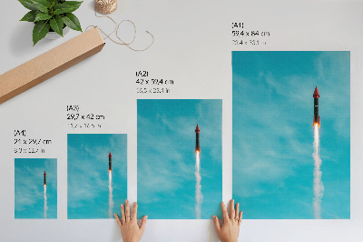 Decorative poster A rocket rising into the blue sky