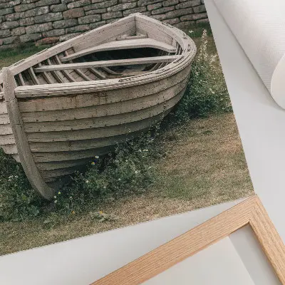 Decorative poster featuring an abandoned boat on a tranquil grassy nature landscape