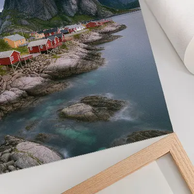 Premium wall art featuring red houses, mountains, and water in a peaceful landscape