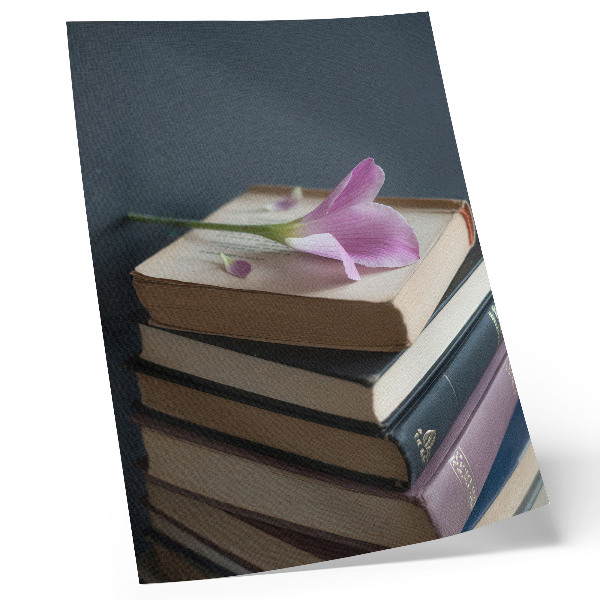 Premium wall art A stack of books with a delicate flower on top