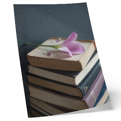 Premium wall art A stack of books with a delicate flower on top