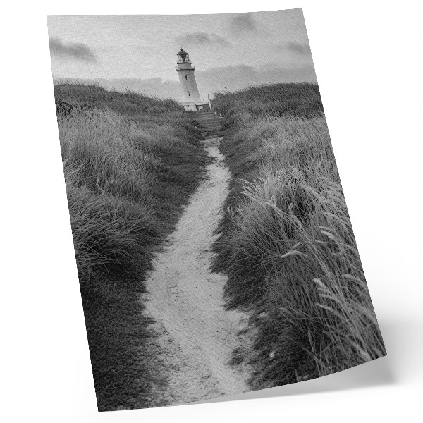 Poster A lighthouse against a background of tall grass