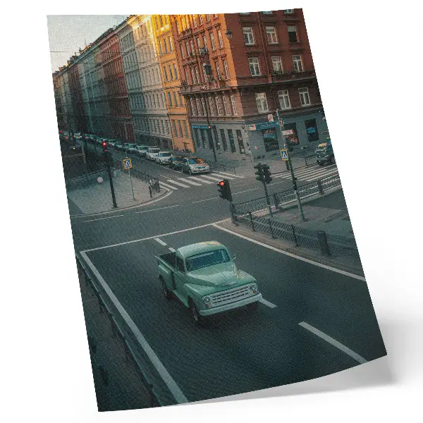 Art print featuring a retro car parked in front of tenement houses at sunset