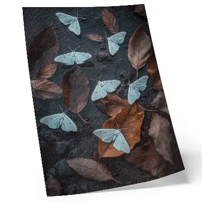 Poster butterflies against a background of autumn-colored leaves