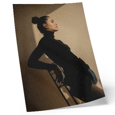 Poster Dark silhouette of a woman, a ray of light, peace