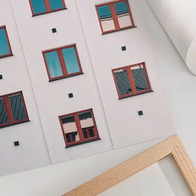 Decorative poster orange frames, blue windows, and white facade