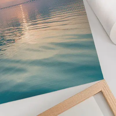 Poster calm water surface with a bridge reflecting warm sky colors