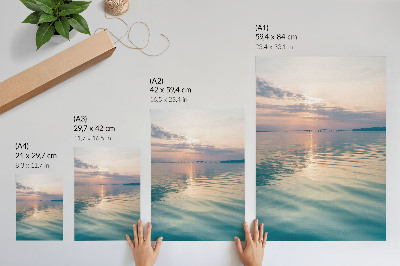 Poster Calm water surface, warm colors of the sky, bridge