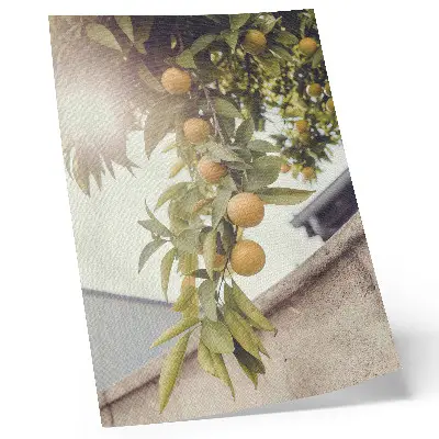 Decorative poster featuring a sunlit tree branch with green leaves and orange accents