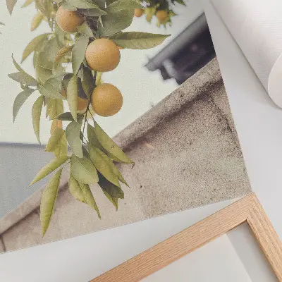 Decorative poster featuring a sunlit tree branch with green leaves and orange accents