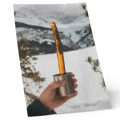 Art print featuring a mountain landscape with amber snow and a mug