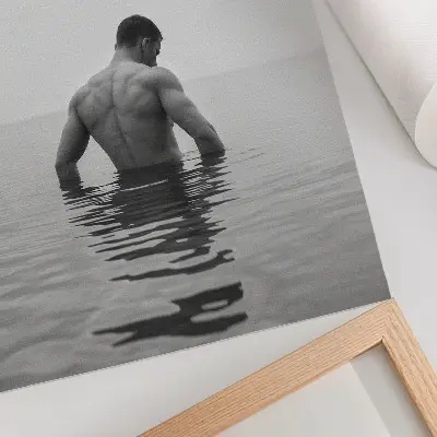 Art print man upside down in calm water against a gray background
