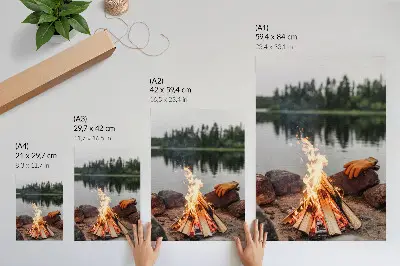 Decorative poster featuring a bonfire by a serene forest lake with stones