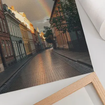 Poster colorful tenement houses with a rainbow in a cloudy sky