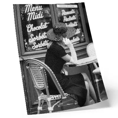 Art print woman wearing a hat at a table in a cafe