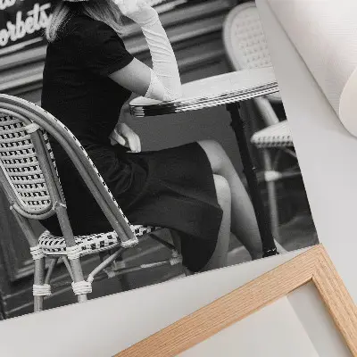 Art print woman wearing a hat at a table in a cafe