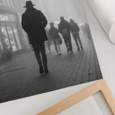 Decorative poster featuring a mysterious figure in a hat with fog and umbrellas