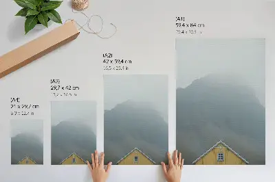Decorative poster featuring a peaceful yellow house in the foggy mountains