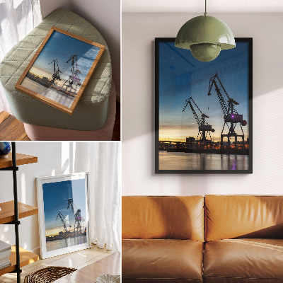 Poster Cranes against the backdrop of a dynamic sunset scenery